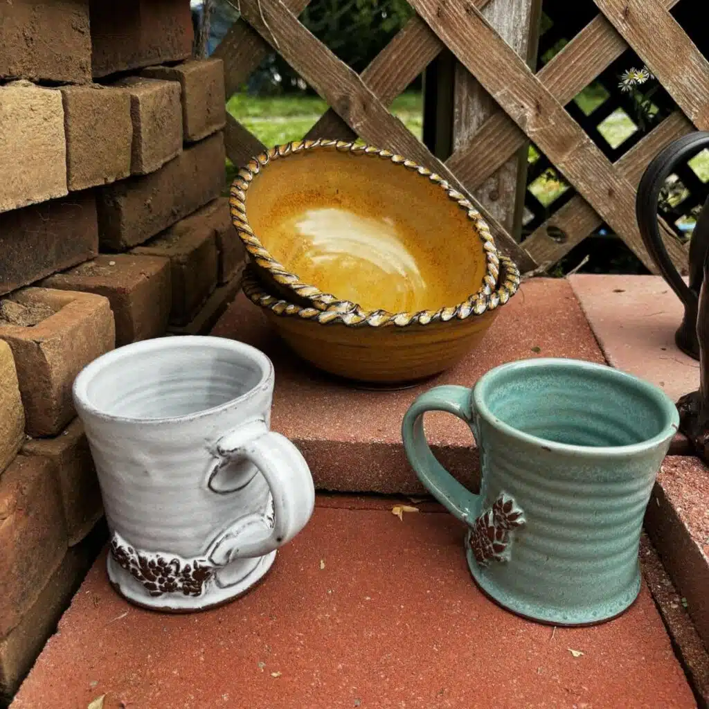 Cups and bowls made by ARJO Pottery.