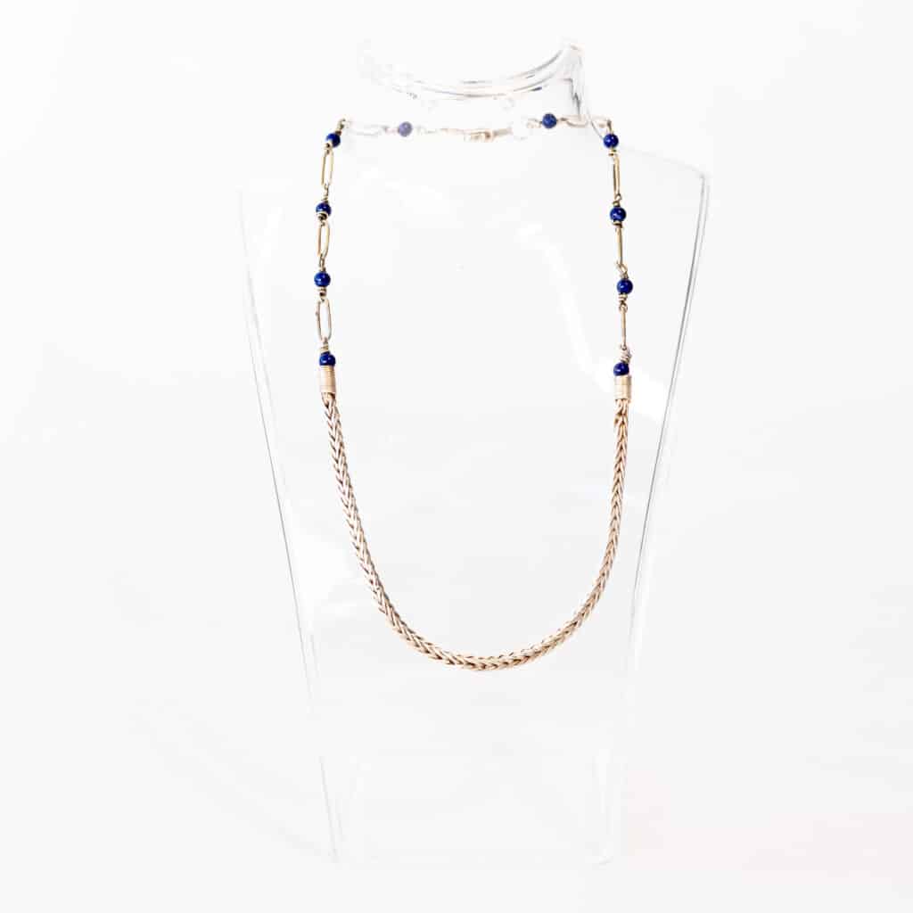 A silver and lapis lazuli necklace.