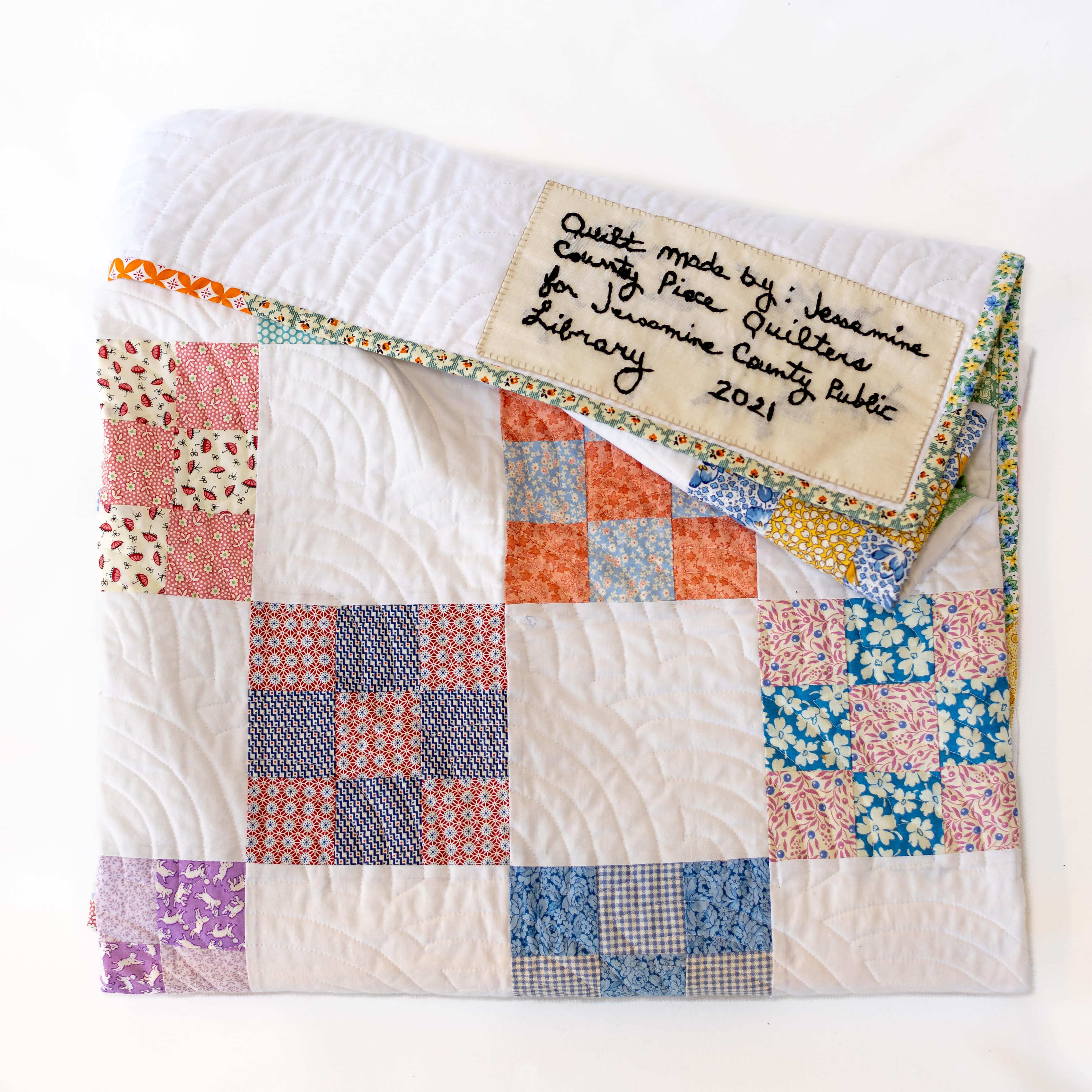 A homemade quilt by the Jessamine Piece Quilters.