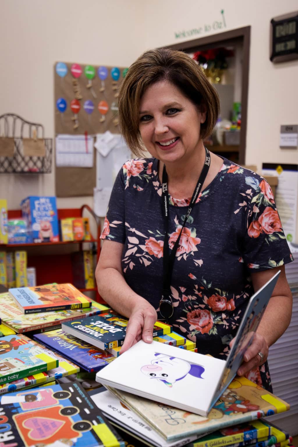 Children's Outreach Librarian Sharon chooses books to deliver to preschools.