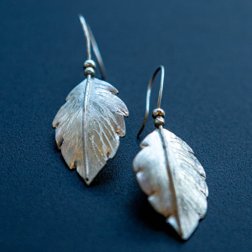 Silver leaf earrings.